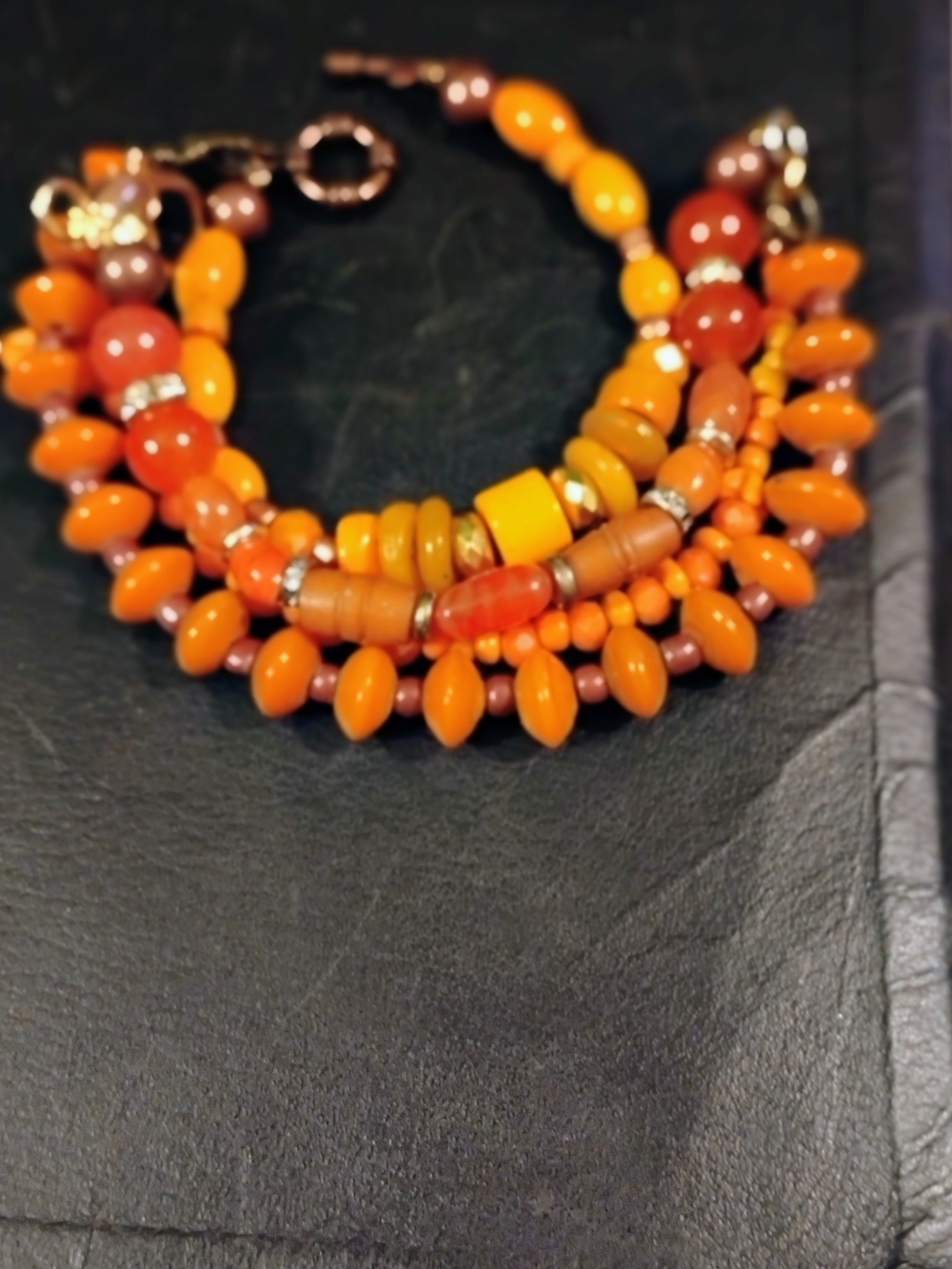 Hand Crafted Orange Multi-Strand Beaded Bracelet with Brown Accents